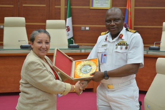 Representative of the CDS, Rear Admiral Egbedina presenting a souvenir to UNICEF team leader, Ms Jean Gough.JPG